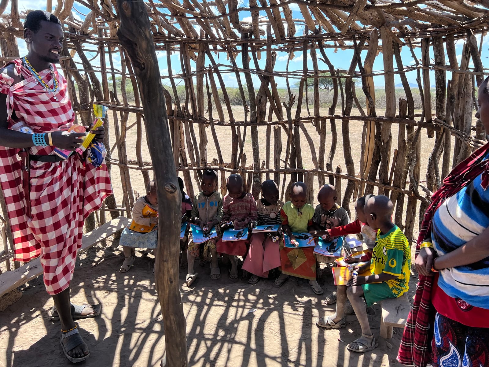 Children gathered in a Maasai village schoolroom