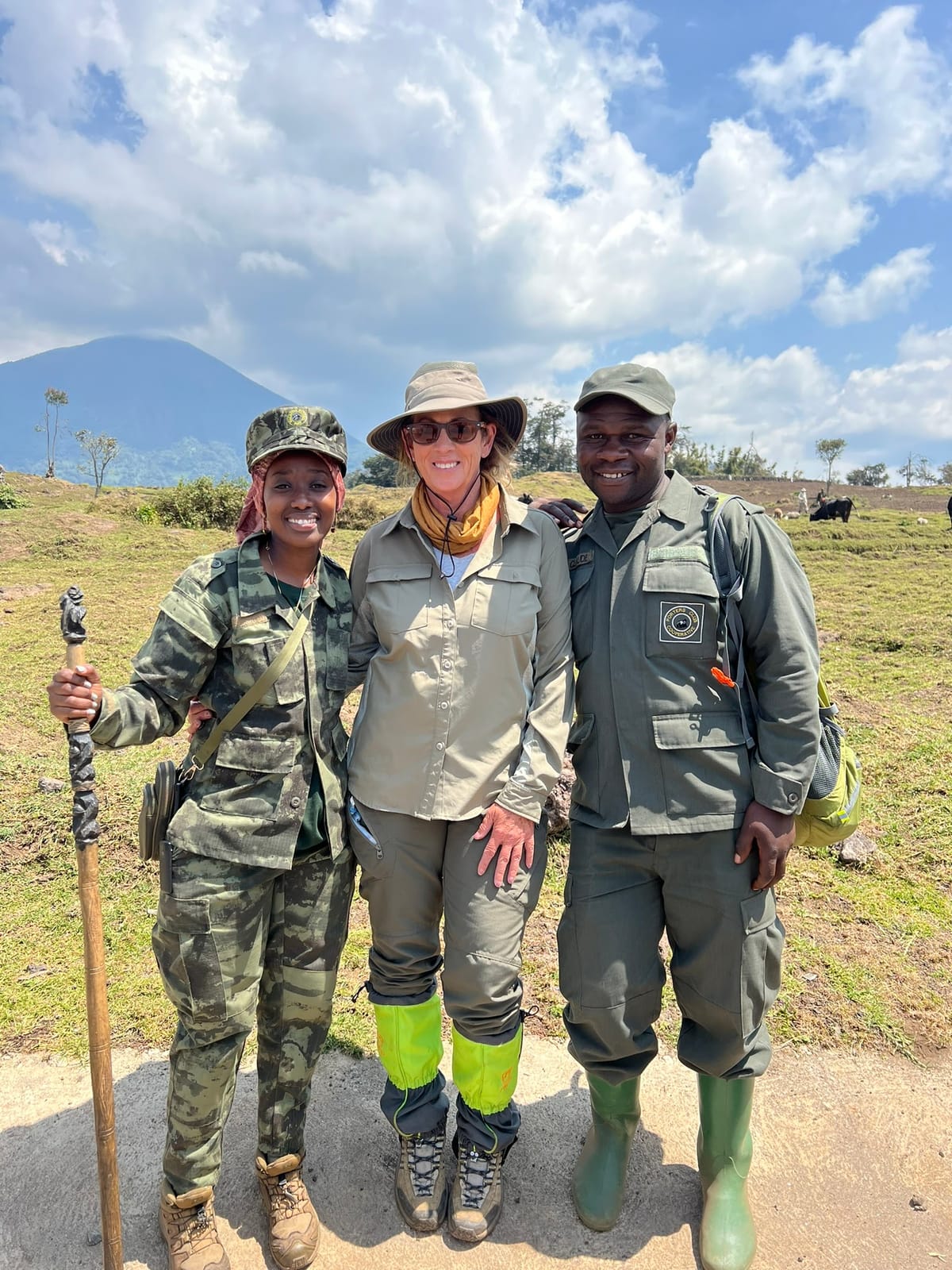 Nancy with two park rangers in Rwanda