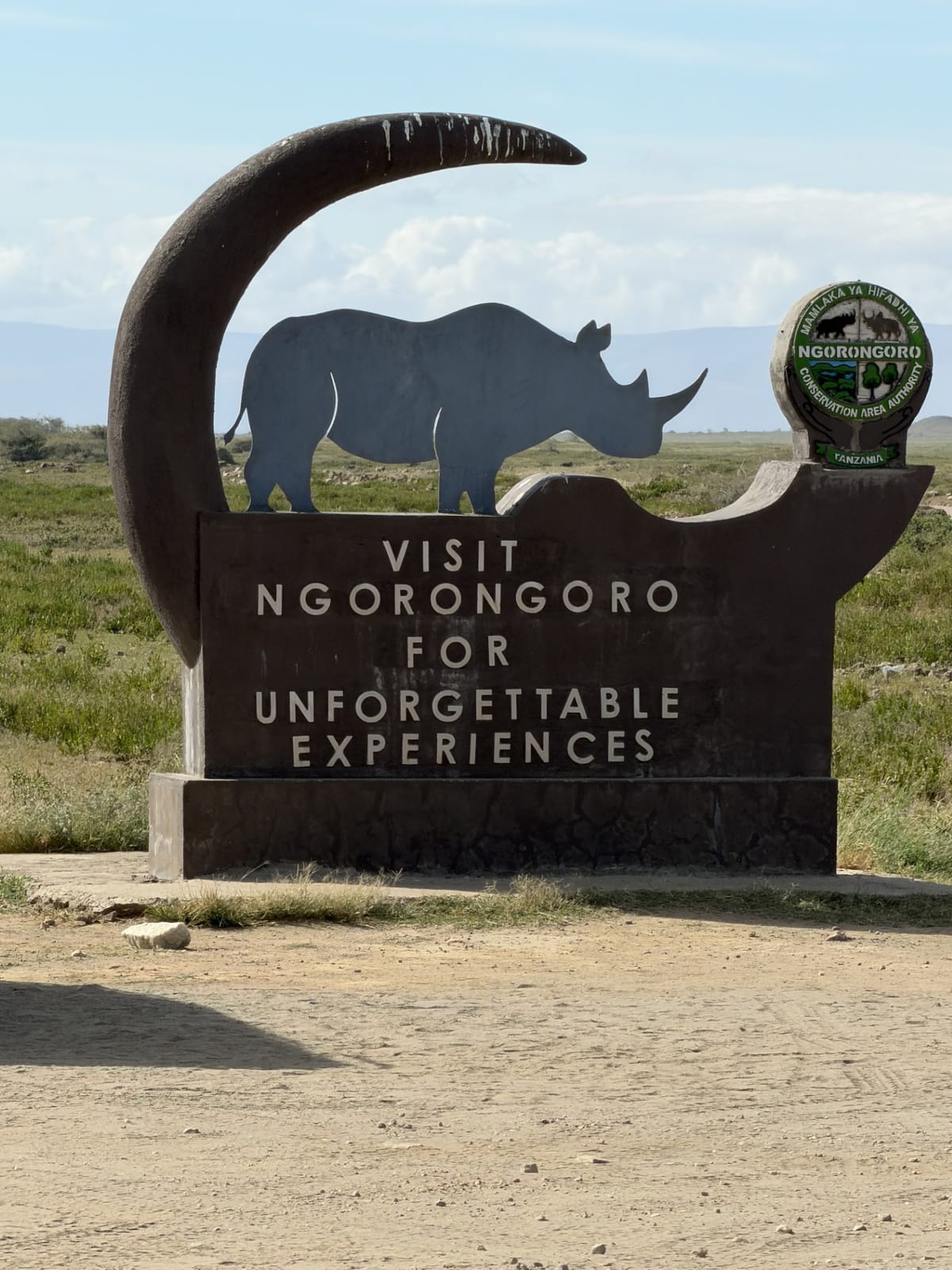 The Visit Ngorongoro sign with its rhino silhouette
